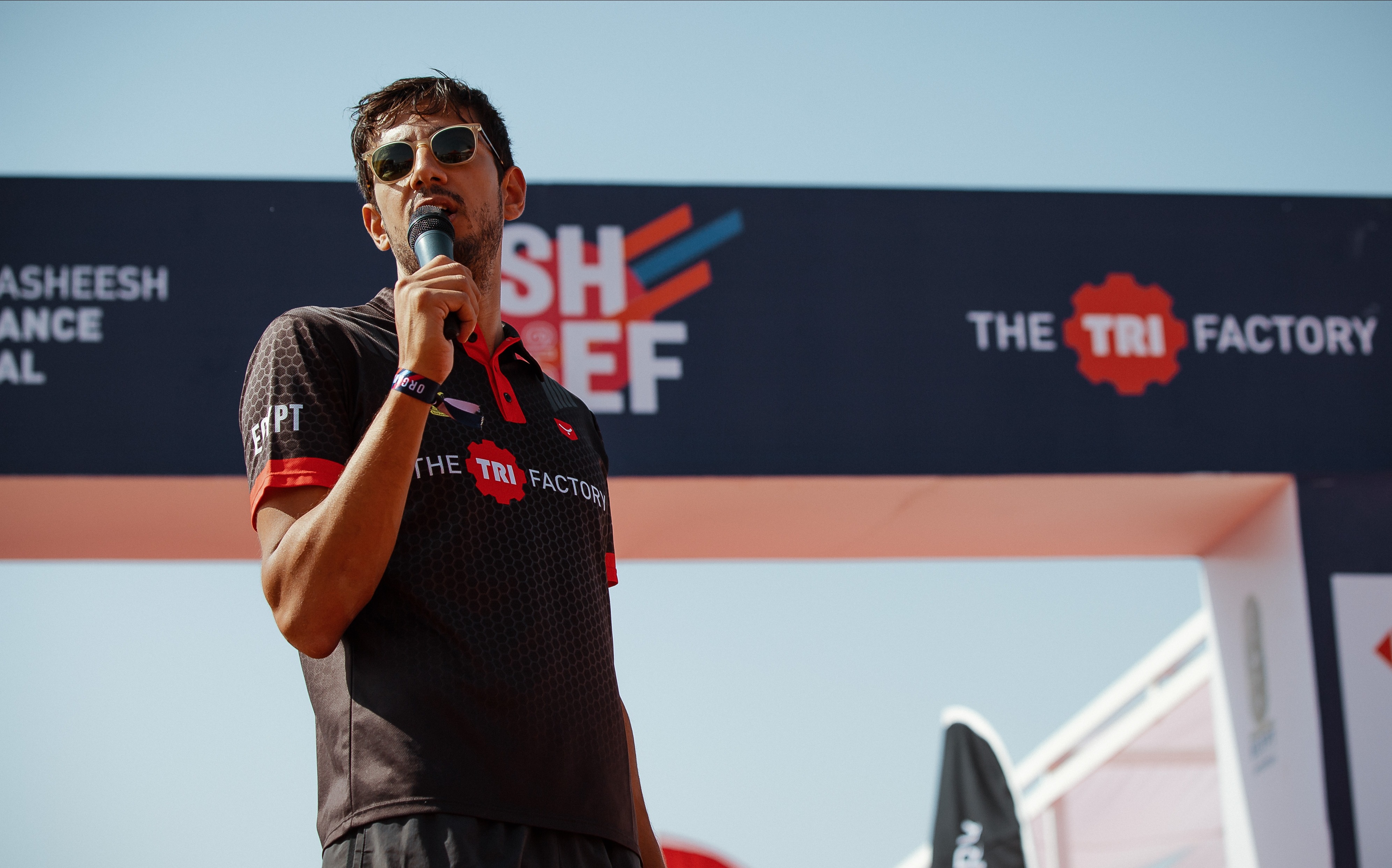 Seif Fawzy speaking into the mic